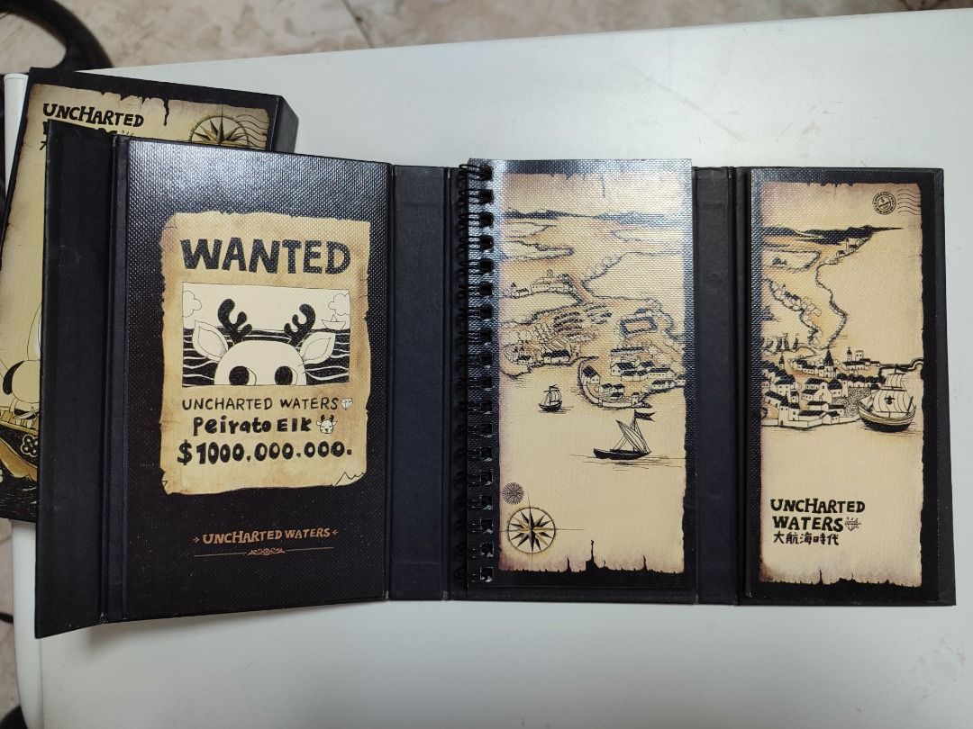 Uncharted Waters Notebook Set with Maps and Wanted Poster (Category: Storybooks) located in Mandaluyong City. Submitted by thethrifthaul (Listing ID 1463872460, Image 1). Description: - Set of 2 Uncharted Waters notebooks - Features a 'Wanted' poster with a deer and bounty - Second notebook has maps and ship/town illustrations - Both covers have cool pirate ship designs - Includes a protective box - Ideal for fans of adventure and nautical themes