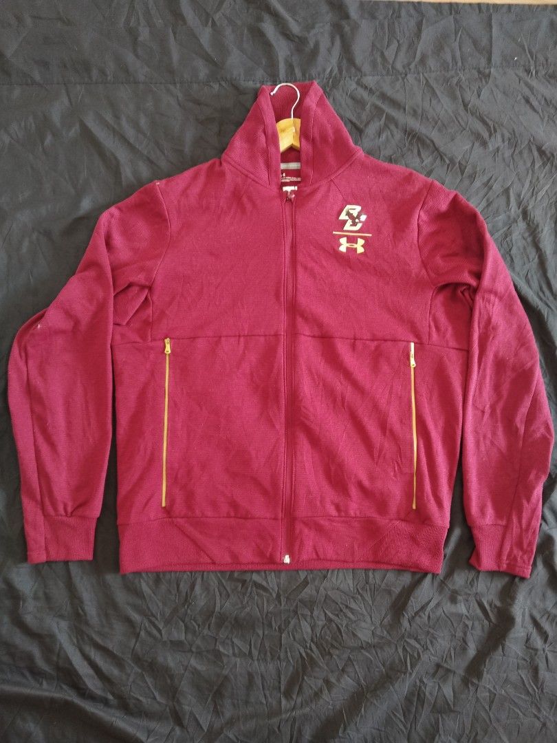 Under Armour Jacket (Category: Coats, Jackets and Outerwear) located in Mabalacat. Submitted by al_amin_thrift (Listing ID 1463765917, Image 1). Description: ✅ Brand: Authentic Under Armour — ColdGear series ✅ Color: Maroon / Burgundy with Gold accents ✅ Size: L — Loose Fit ✅ Features: - Official Boston College (BC) Eagles collegiate logo ​ - Full-zip front closure ​ - Gold-tone zippered side pockets ​ - High stand-up collar ​ - ColdGear lightwei