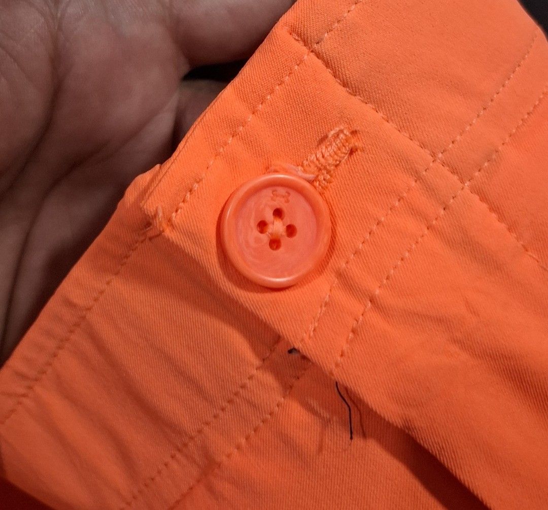 Under Armour Orange Golf Shorts Size 38 (Category: Shorts) located in Sorsogon. Submitted by johnmichae69459 (Listing ID 1463866305, Image 3). Description: - Orange Under Armour golf shorts - Size: 38 waist - 20 lenght - Material: 90% Polyester, 10% Elastane - Made in: Jordan - Features: Button closure, zip fly, two front pockets, one back pocket with button closure - Comfort: Ideal for golf or everyday wear - Branding: Under Armour logo on back 