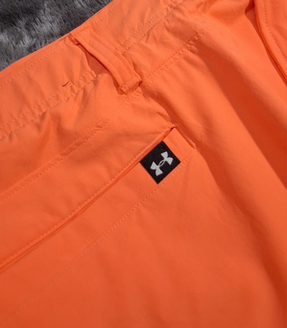 Under Armour Orange Golf Shorts Size 38 (Category: Shorts) located in Sorsogon. Submitted by johnmichae69459 (Listing ID 1463866305, Image 2). Description: - Orange Under Armour golf shorts - Size: 38 waist - 20 lenght - Material: 90% Polyester, 10% Elastane - Made in: Jordan - Features: Button closure, zip fly, two front pockets, one back pocket with button closure - Comfort: Ideal for golf or everyday wear - Branding: Under Armour logo on back 