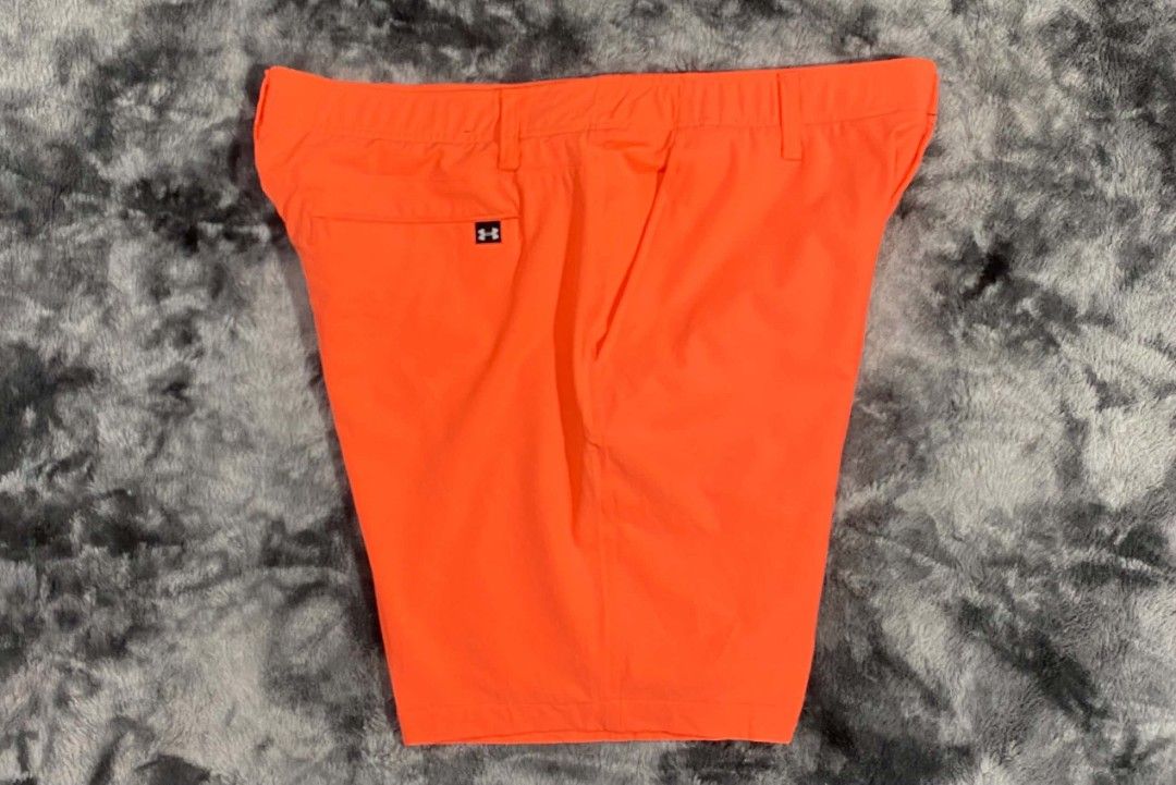 Under Armour Orange Golf Shorts Size 38 (Category: Shorts) located in Sorsogon. Submitted by johnmichae69459 (Listing ID 1463866305, Image 1). Description: - Orange Under Armour golf shorts - Size: 38 waist - 20 lenght - Material: 90% Polyester, 10% Elastane - Made in: Jordan - Features: Button closure, zip fly, two front pockets, one back pocket with button closure - Comfort: Ideal for golf or everyday wear - Branding: Under Armour logo on back 
