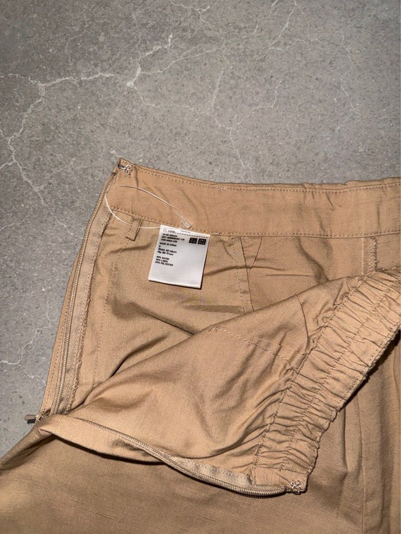 Uniqlo | Beige Wrap Skort (Category: Skirts) located in Muntinlupa City. Submitted by diananeedsspace (Listing ID 1463881783, Image 3). Description: - Uniqlo beige wrap skirt - Elastic waistband at the back for comfort - Side zip closure - Versatile for casual or dressed-up occasions.