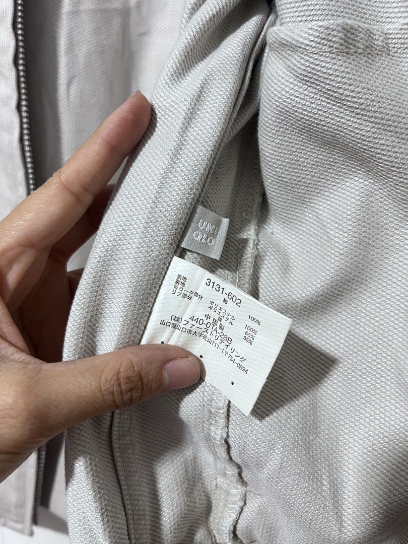 Uniqlo Bomber Jacket Size S Beige (Category: Coats, Jackets and Outerwear) located in Baguio. Submitted by miisthyshop.ph (Listing ID 1463871642, Image 3). Description: - Uniqlo Beige Bomber Jacket - Size: S - Material: 100% Cotton - Features: Ribbed collar, cuffs, and hem - Pockets: Two chest pockets with button closures - Closure: Zip-up front - Style: Great for layering Note: Im selling ukay ukay please manage your expectations. Wash before we