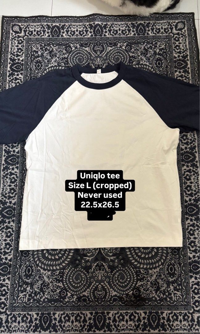 Uniqlo Cropped Raglan Tee Size L (Category: Tshirts & Polo Shirts ) located in Makati City. Submitted by sseurekiii (Listing ID 1463754719, Image 1). Description: - Uniqlo Cropped Raglan Tee - Size: L - Color: White body with navy blue sleeves - Condition: Brand new, never used - Measurements: 22.5 inches (width) x 26.5 inches (length) - Style: Classic, versatile basic piece.