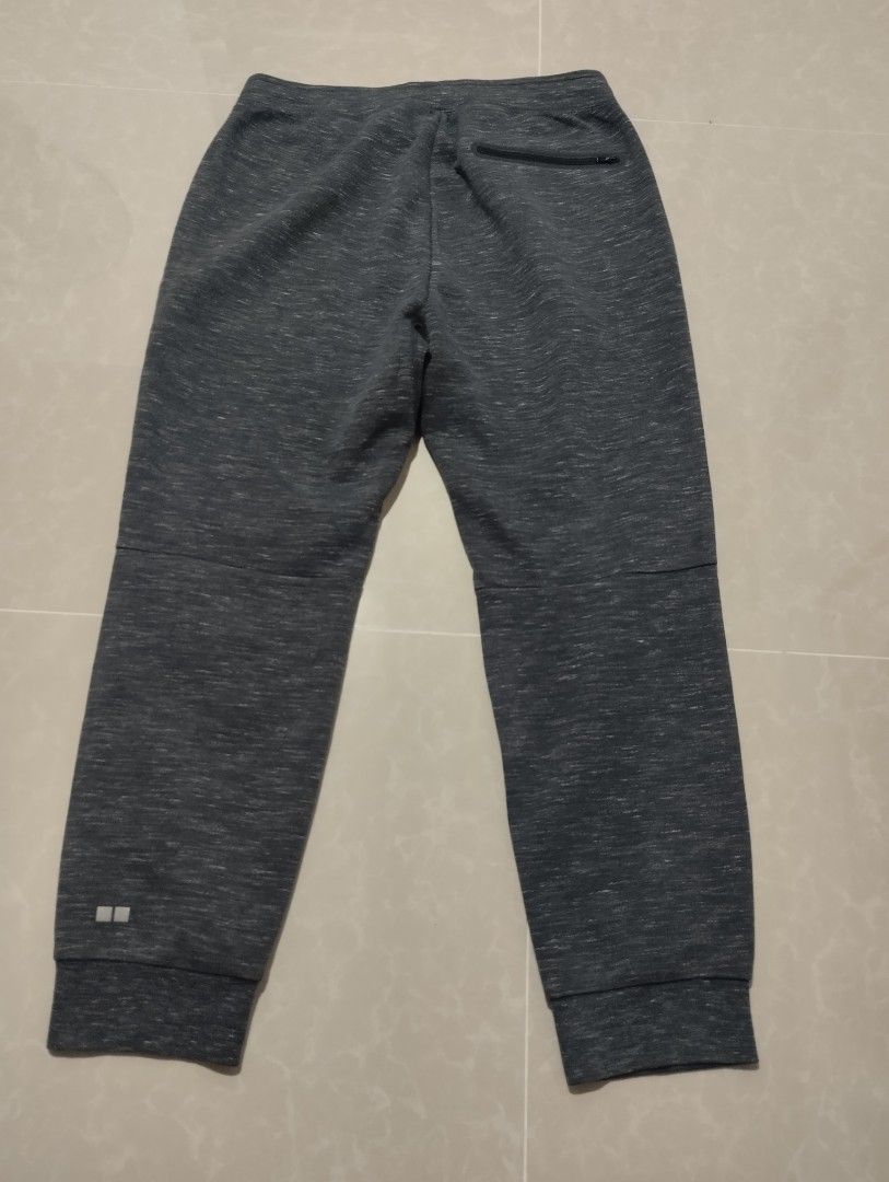 Uniqlo Grey Jogger Sweatpants Size M (Category: Joggers) located in Mabalacat. Submitted by uniqlover (Listing ID 1463863213, Image 3). Description: - Uniqlo Grey Jogger Sweatpants - Size: Medium (M) - Color: Grey Marl - Material: Comfortable blend, perfect for lounging - Features: Zippered front pockets, drawstring waist, ribbed cuffs and waistband - Origin: Made in China - Ideal for: Everyday casual wear, relaxing at home.