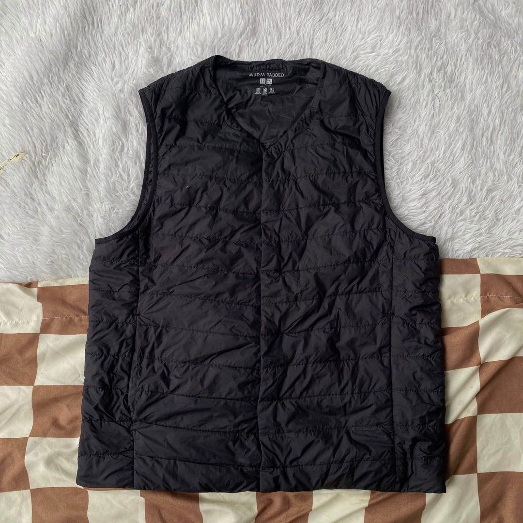 uniqlo pocketable warm padded vest (Category: Coats, Jackets and Outerwear) located in Mariveles. Submitted by mariathriftandpreloved (Listing ID 1463868856, Image 3). Description: Uniqlo pocketable warm padded vest (unisex) Med on tag width 21 length 25 like new black with pouch Loc: Bataan Courier: J&T.