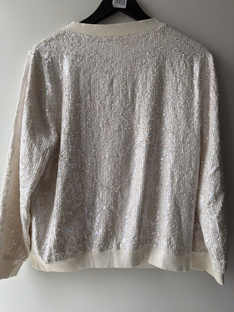 Vanessa Bruno Athe Cream Sequin Cable Knit Sweater (Category: Coats, Jackets and Outerwear) located in Makati City. Submitted by cheapipie (Listing ID 1463773268, Image 3). Description: - Cream cable knit sweater with eye-catching sequins. Retails for $320 - Features a stylish blue and black stripe detail across the chest. - Long sleeves with ribbed cuffs and hem for a comfortable fit. - Ideal for a night out or any festive occasion. - Approximat