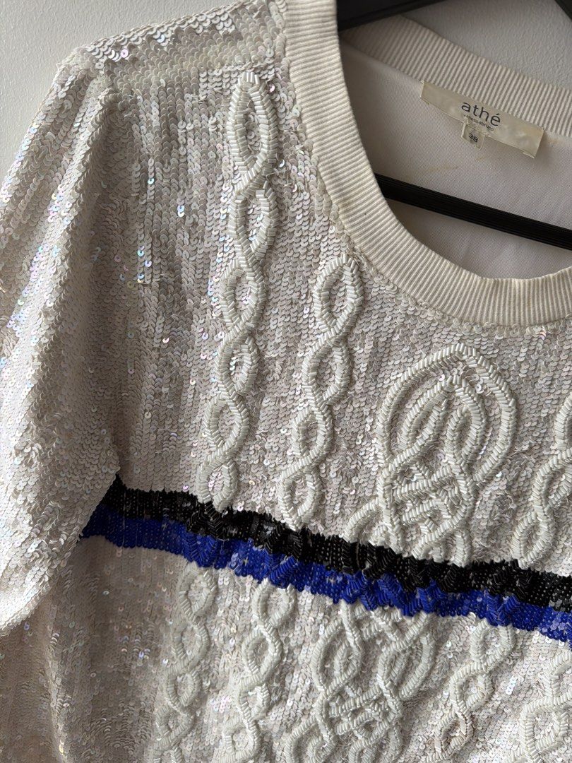 Vanessa Bruno Athe Cream Sequin Cable Knit Sweater (Category: Coats, Jackets and Outerwear) located in Makati City. Submitted by cheapipie (Listing ID 1463773268, Image 2). Description: - Cream cable knit sweater with eye-catching sequins. Retails for $320 - Features a stylish blue and black stripe detail across the chest. - Long sleeves with ribbed cuffs and hem for a comfortable fit. - Ideal for a night out or any festive occasion. - Approximat