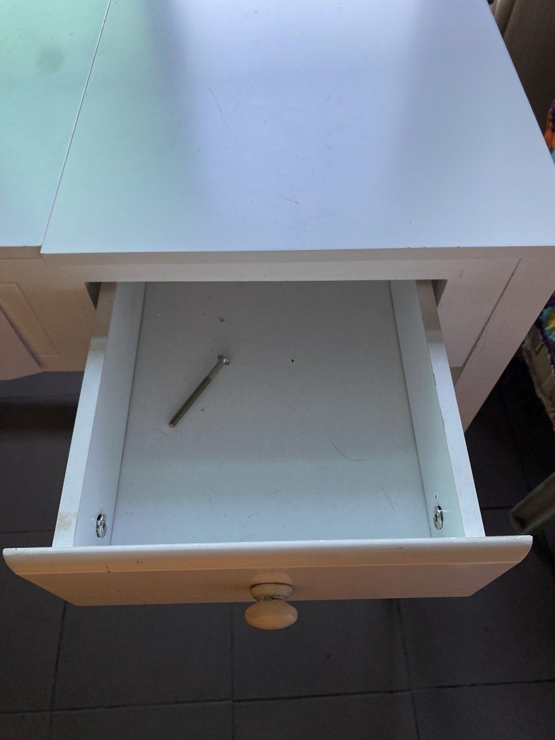 Vanity table (Category: Shelves, Cabinets & Racks) located in Manila. Submitted by abigailpat47098 (Listing ID 1463937424, Image 1). Description: - White drawer unit - Single drawer with wooden knob - Minor scratches on surface - Nail present inside drawer - Sold as is.