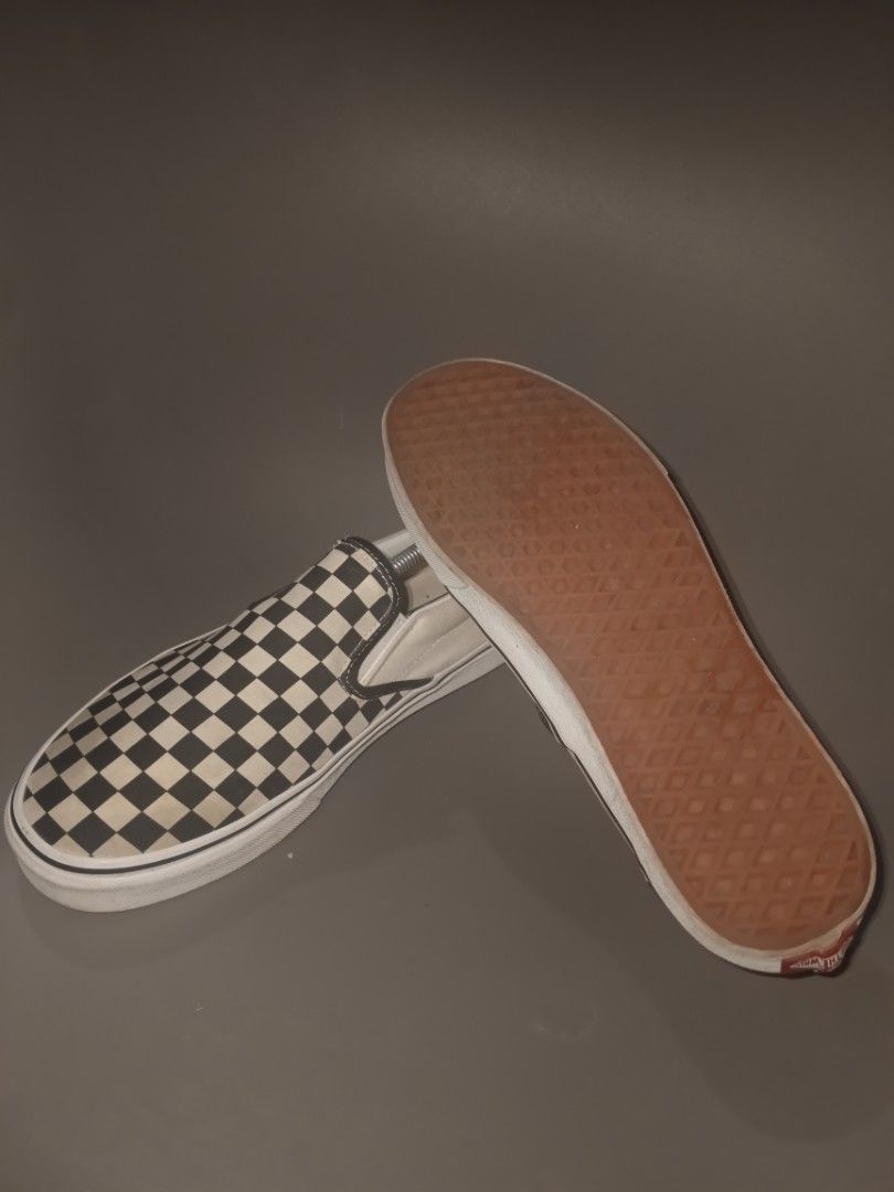 Vans Checkerboard Slip-On Shoes (Category: Sneakers) located in Manila. Submitted by ashlyjhon (Listing ID 1463866345, Image 2). Description: - Classic Vans checkerboard slip-on shoes - Iconic white and black pattern - Easy slip-on design for convenience - Soles show some wear but retain good grip - A versatile staple for any casual outfit.