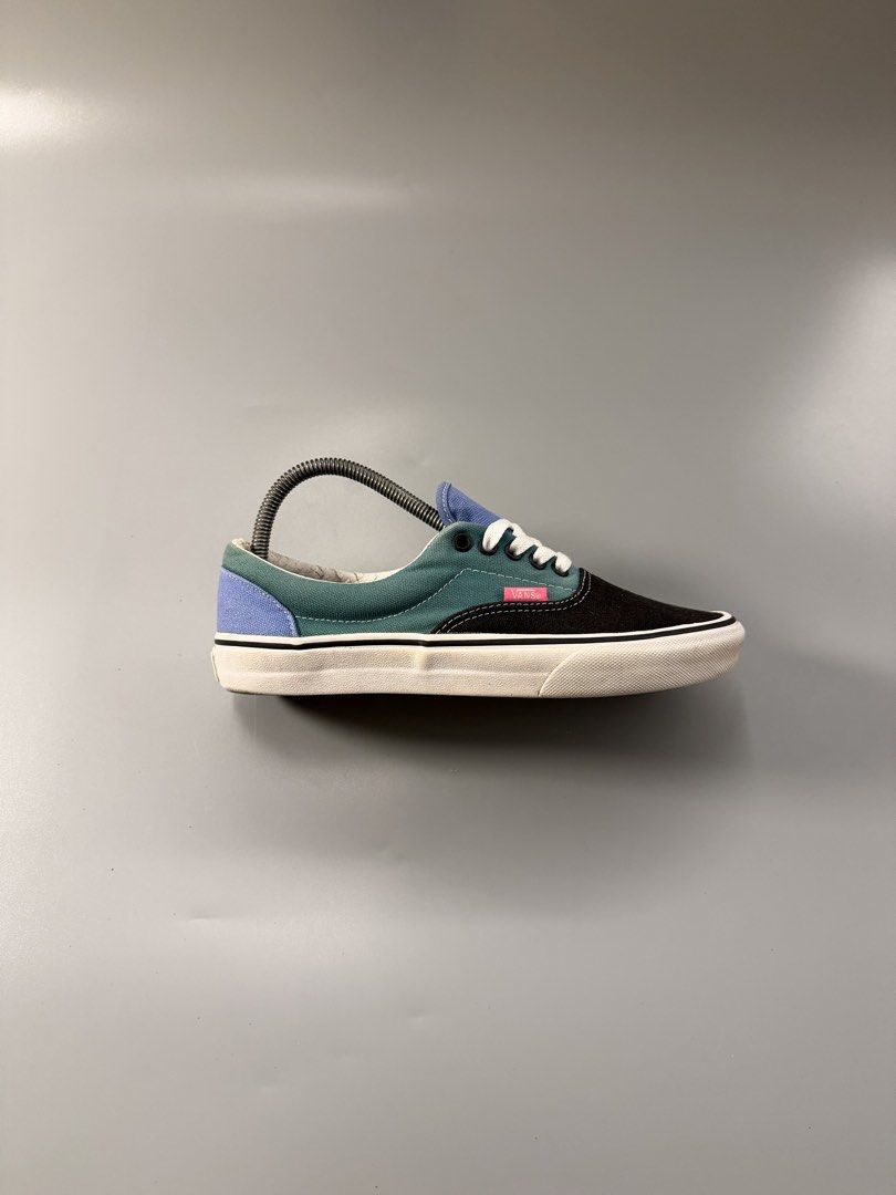 Vans Era Colorblock Sneakers (Category: Sneakers) located in Caloocan City. Submitted by maempenafi21452 (Listing ID 1463751349, Image 2). Description: - Vans Era sneakers in a vibrant colorblock design. - Features eye-catching panels of black, teal, yellow, and blue. - Crisp white laces and matching white soles for a clean look. - Iconic Vans branding proudly displayed on the heel. - Ideal for adding a pop of color to your casual outfits..