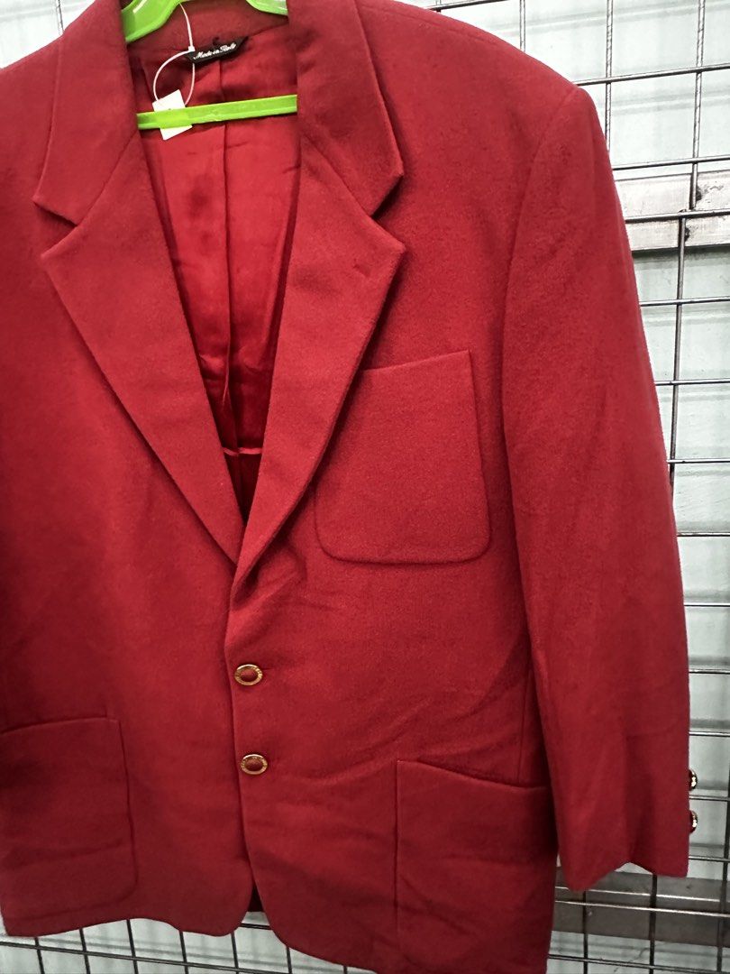 Versace Jeans Couture Red Wool Blend Blazer (Category: Luxury Apparel) located in Urdaneta. Submitted by redeemedcollective (Listing ID 1463926179, Image 3). Description: Red Versace Jeans Couture blazer with a notched lapel, three patch pockets, branded gold-tone buttons and a contrasting dark underside on the collar. The labels show “Made in Italy” and a wool-blend fabric. Condition: Pre-owned. A lower front button appears to be missing, and th
