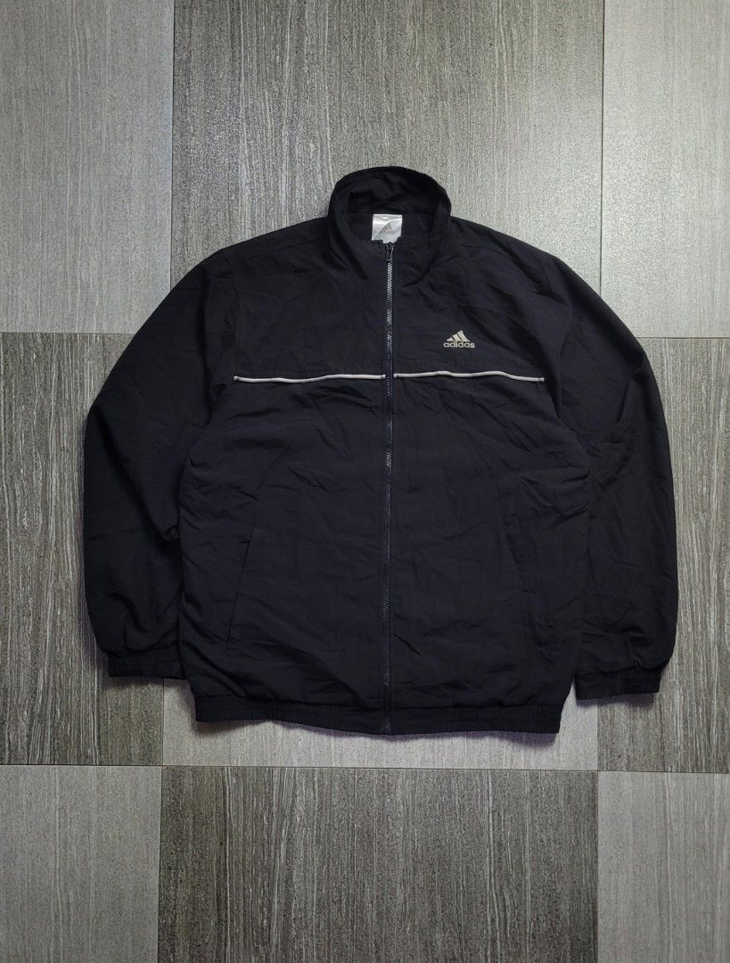 VINTAGE ADIDAS WINDBREAKER (Category: Hoodies) located in Manila. Submitted by 7100treasure.co (Listing ID 1463882777, Image 1). Description: VINTAGE ADIDAS WINDBREAKER • Style: Vintage Windbreaker • Color: Black • Breathable black mesh interior lining • Classic embroidered Adidas Performance logo • White piping design across the chest and back • Full-zip closure • Elastic cuffs and bottom hem • Width: 28" • Length: 22" ​📍 Dipolog City, Zamboang