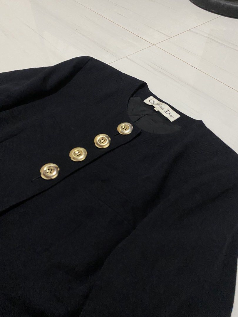 Vintage Christian Dior Collarless blazer (Category: Coats, Jackets and Outerwear) located in Manila. Submitted by morsgotthrift (Listing ID 1463833057, Image 3). Description: Vintage Christian Dior Black Collarless Textured Fabric With Gold Tone Bottons blazer Color may vary due to lighting 100% Authentic Excellent Condition Size L on tag Width - 20 Length - 30 Sleeve - 21 Shoulder - 18 No issue No flaws excellent color rate 1,980+sf.