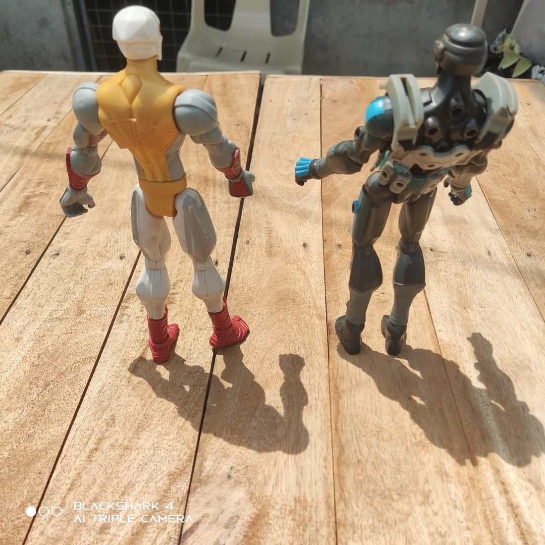 Vintage G.I. Joe action figures (Category: Figurines & Statues) located in Bugallon. Submitted by ariel013 (Listing ID 1463784270, Image 2). Description: - Set of 2 action figures - Futuristic robot with grey and blue accents - Ninja-style figure in yellow, white, and red - Both figures have articulated joints for posing - Ideal for collectors or imaginative play.