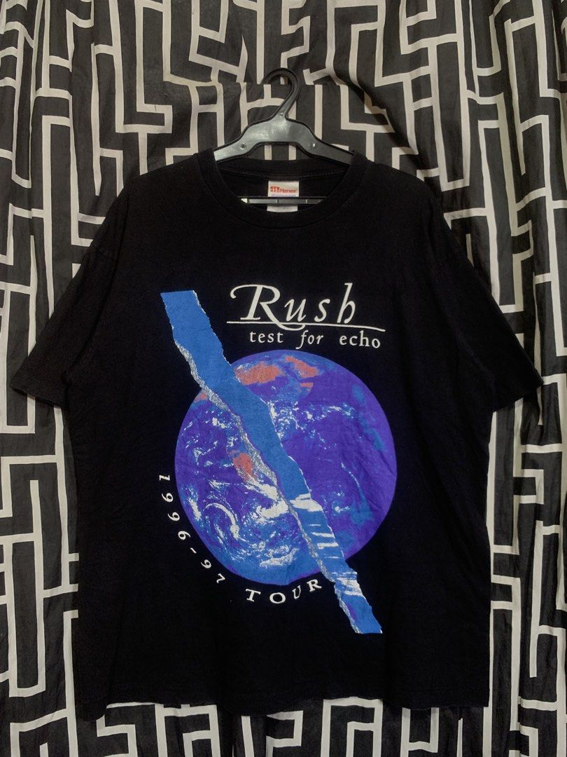 VINTAGE RUSH BAND TEE 90’s (Category: Activewear) located in Manila. Submitted by bibiies2.0xghettothrift (Listing ID 1463892631, Image 1). Description: Details W23 L29 Large on tag Black pa Minimal hairline Loc.Baclaran Paranaque.