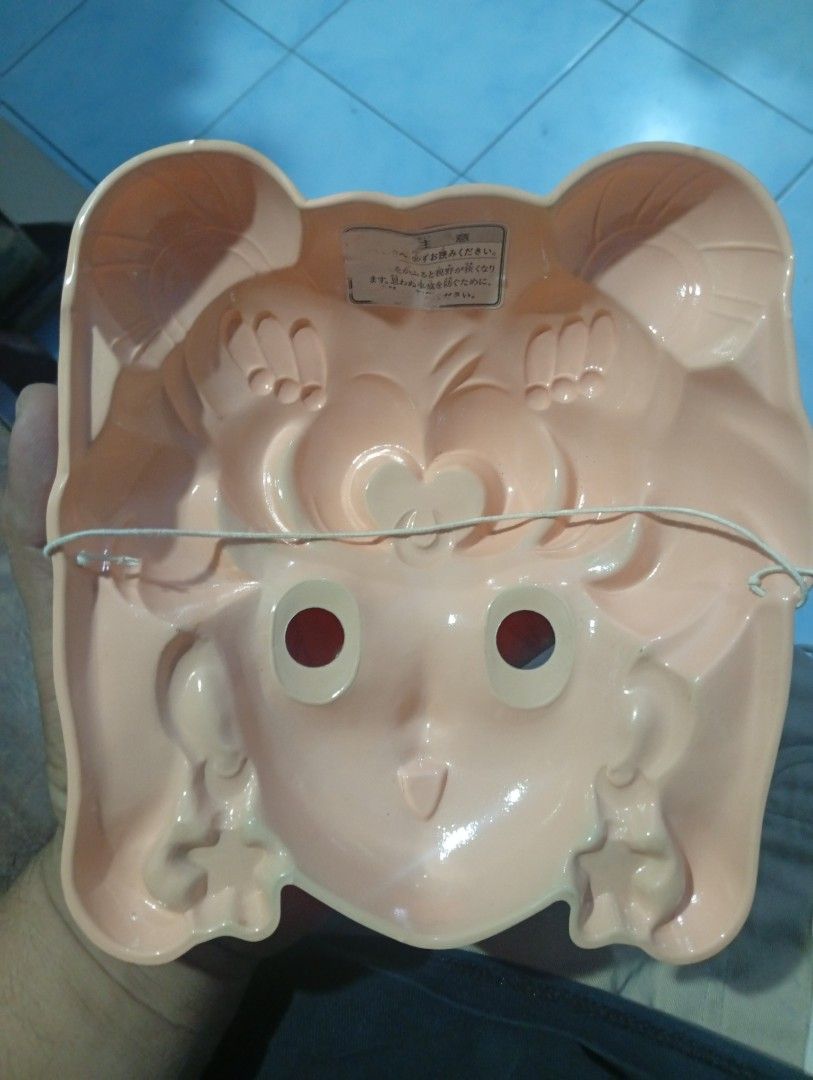 Vintage Sailor Moon Plastic Mask Toy (Category: Vintage Collectibles) located in San Mateo. Submitted by waynetek14 (Listing ID 1463833502, Image 3). Description: Selling a vintage Sailor Moon mask. Made of plastic. Features the character's iconic blonde hair, blue eyes, and star earrings. Has eye holes for wearing. Great for collectors or cosplay. Shows some signs of age but still displays well. A fun piece of anime memorabilia..