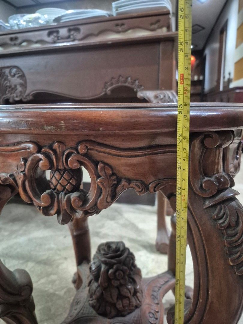Vintage Wooden Console Table and Side Tables Set (Category: Tables & Sets) located in Taguig. Submitted by firesale123 (Listing ID 1463812376, Image 3). Description: - Vintage wooden furniture set - Includes: 1 long console table & 2 round side tables with glass tops - Features beautiful carved details on legs and edges - Console table has ornate front panel carvings - Side tables feature a floral motif - Ideal for classic or antique-themed decor
