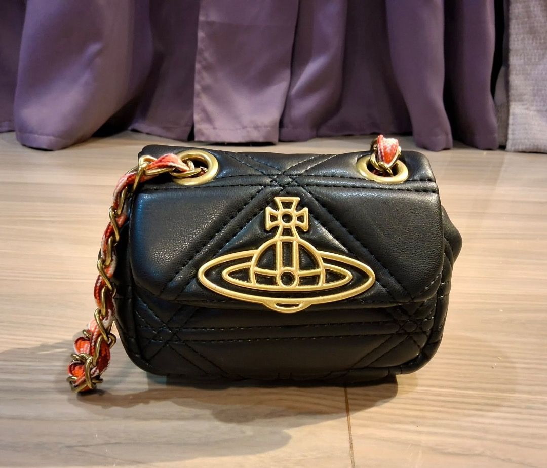 Vivienne Westwood Quilted Micro sling (Category: Luxury Bags & Wallets) located in Albuera. Submitted by zaraofdammam09 (Listing ID 1463803080, Image 1). Description: - Super cute - Iconic gold Vivienne Westwood orb logo - Multiple use (can be worn as shoulder/sling/crossbody).