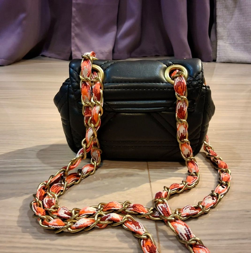 Vivienne Westwood Quilted Micro sling (Category: Luxury Bags & Wallets) located in Albuera. Submitted by zaraofdammam09 (Listing ID 1463803080, Image 2). Description: - Super cute - Iconic gold Vivienne Westwood orb logo - Multiple use (can be worn as shoulder/sling/crossbody).