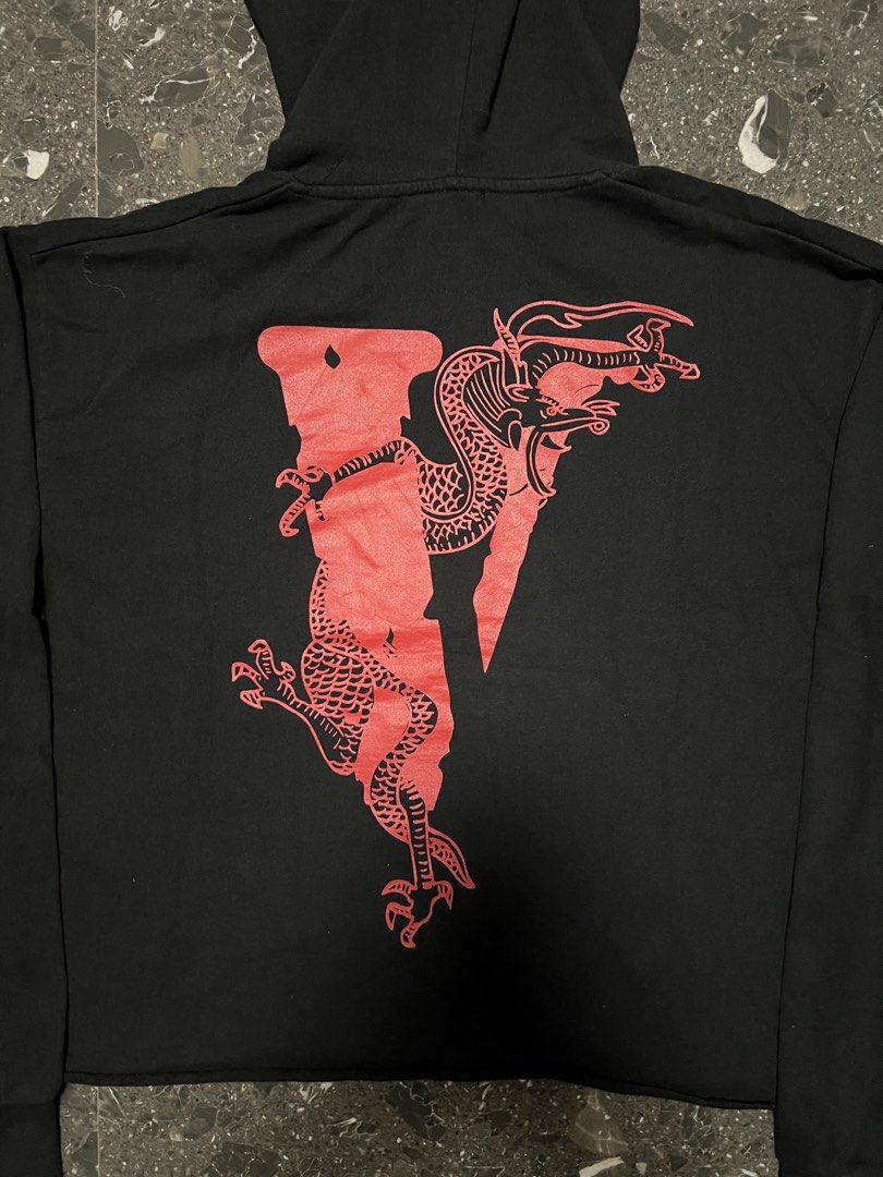 VLONE Black Hoodie (Category: Coats, Jackets and Outerwear) located in Manila. Submitted by justin_sy (Listing ID 1463830083, Image 3). Description: - Black VLONE hoodie - Features red and white graphic print on the front - Long sleeves with ribbed cuffs - Adjustable drawstring hood - Cropped fit design - Ideal for casual wear.