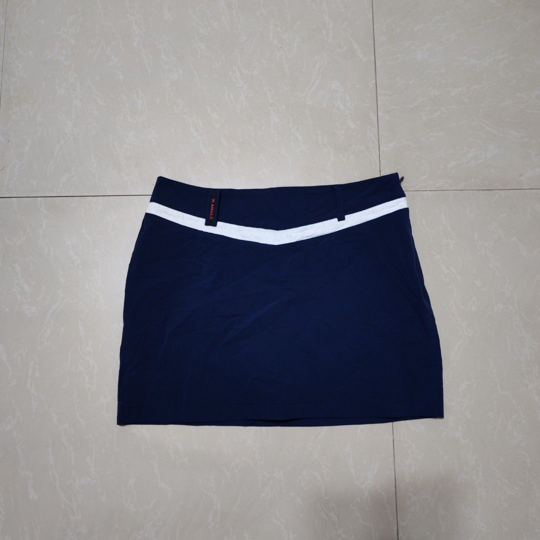 W. ANGLE Golf Skirt Navy Blue White Trim (Category: Skirts) located in Manila. Submitted by ryandip88861707 (Listing ID 1463758725, Image 1). Description: - Navy blue golf skirt - White trim detail at the waistband - Versatile for sports or casual wear - Made with comfortable material.