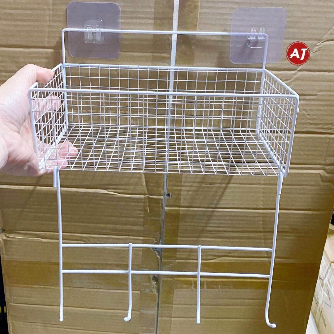 Wall Mounted Storage Basket Shelf with Hooks (Category: Storage Boxes & Baskets) located in Manila. Submitted by iliasjen3082126 (Listing ID 1463929501, Image 3). Description: - Wire storage basket with hooks - Ideal for organizing kitchen items, utensils, or small accessories - Easy wall mounting with included adhesive hooks - Available in white or black - Dimensions: 26cm (L) x 15cm (H) x 13cm (D) - Helps keep your space tidy and clutter-free.