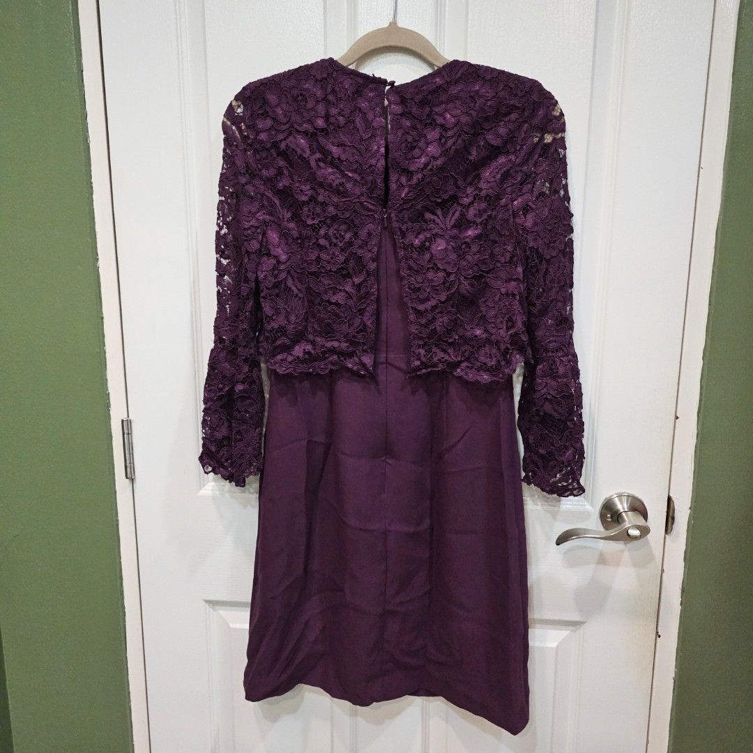 Warehouse Purple Lace Dress (Category: Dresses) located in Makati City. Submitted by goldenbird.001 (Listing ID 1463869950, Image 2). Description: - Warehouse purple dress - Size 10 - Elegant lace overlay on the top - Long sleeves - Solid fabric skirt - Button closure at the back - Ideal for special events.