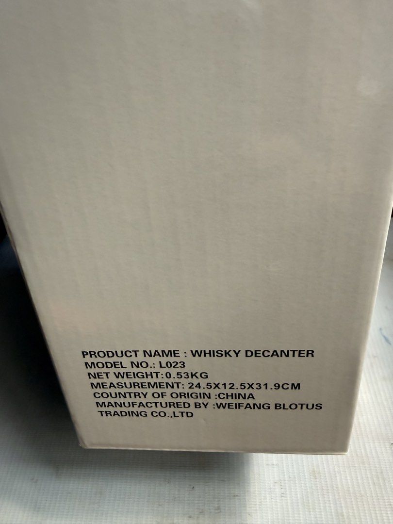 Whisky Decanter L023 (Category: Wine Cellar & Storage) located in Imus. Submitted by silentfire-353921 (Listing ID 1463792463, Image 2). Description: - Barrel-shaped whisky decanter with a convenient tap. - Model: L023 - Net Weight: 0.53kg - Dimensions: 24.5 x 12.5 x 31.9cm - Ideal for serving spirits in style. - Manufactured in China by Weifang Blotus Trading Co., Ltd..