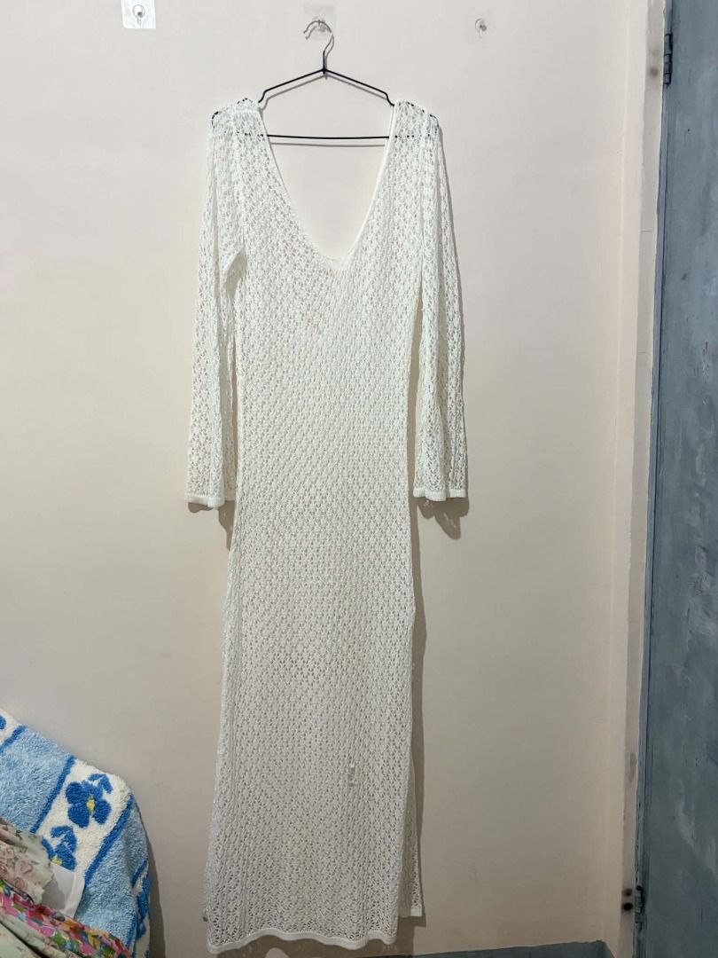 White Crochet Maxi Dress (Category: Dresses) located in San Leonardo. Submitted by burgossanleonardo.12345 (Listing ID 1463907697, Image 1). Description: - Long sleeve white crochet maxi dress - V-neckline - Ideal for beach or as a cover-up - Features a side slit - See-through material - Perfect for summer vibes.