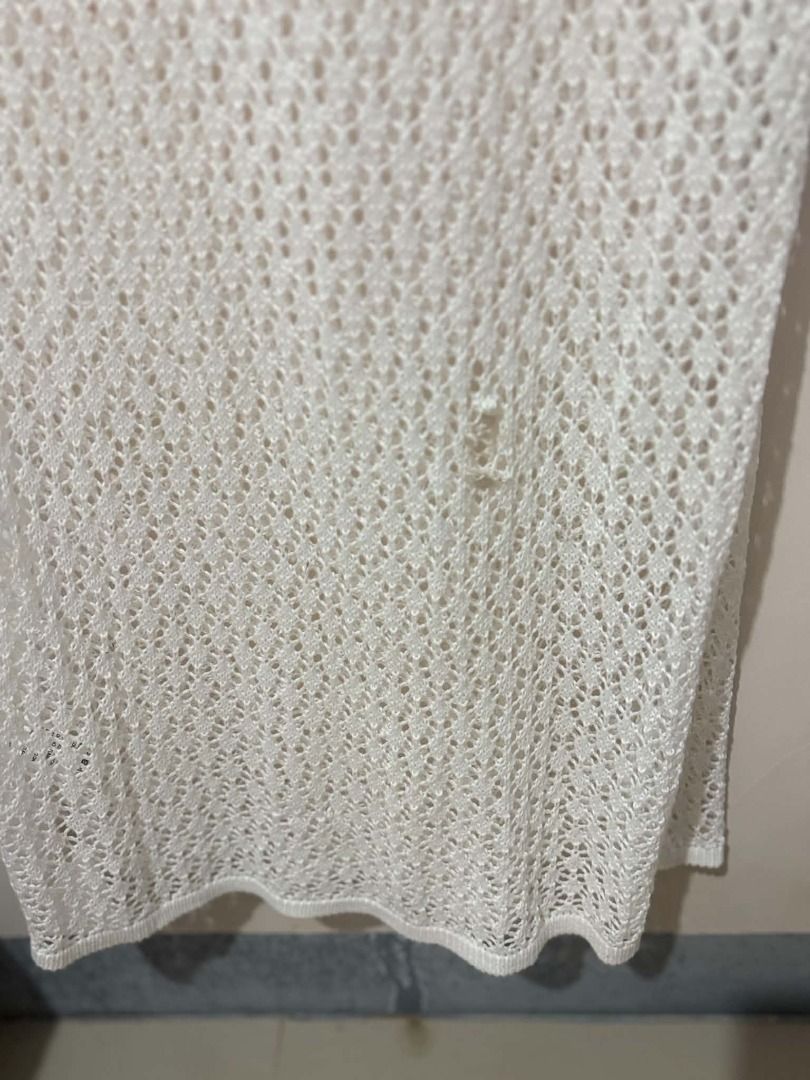 White Crochet Maxi Dress (Category: Dresses) located in San Leonardo. Submitted by burgossanleonardo.12345 (Listing ID 1463907697, Image 2). Description: - Long sleeve white crochet maxi dress - V-neckline - Ideal for beach or as a cover-up - Features a side slit - See-through material - Perfect for summer vibes.