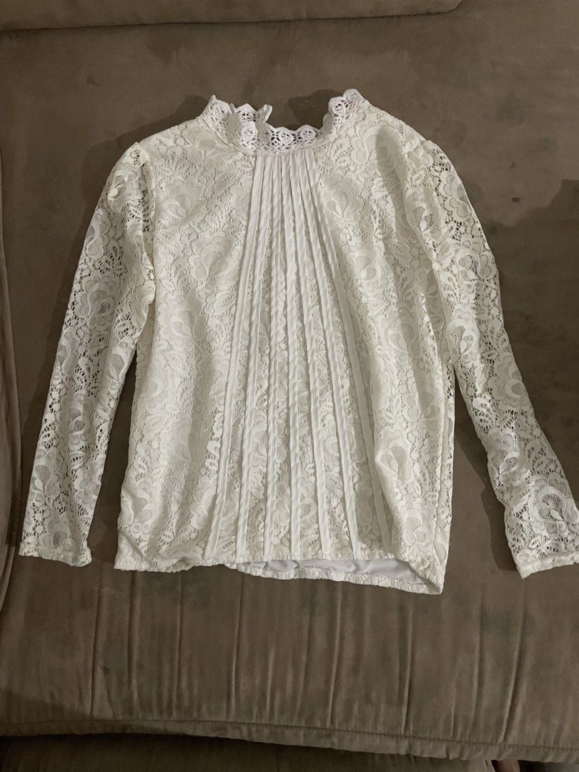 White Lace High Neck Long Sleeve Blouse (Category: Longsleeves) located in Antipolo. Submitted by chicgrc (Listing ID 1463761376, Image 1). Description: 📍marikina / antipolo city 🚚 lalamove 💵 gcash / maya / gotyme - white lace blouse - High neckline and long sleeves - Delicate all-over floral lace pattern - Pintuck details on the front for added texture - Perfect for dressing up or down - Very pretty and elegant when worn.