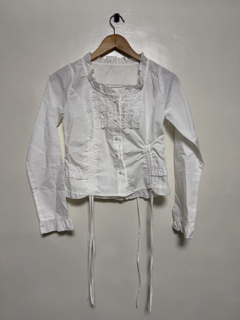 White Long Sleeve Ruffle Front Blouse (Category: Blouses) located in Manila. Submitted by don_p (Listing ID 1463866376, Image 1). Description: S to M - Elegant white long sleeve blouse - Features delicate ruffle detailing down the front - Full button-up closure at the center - Adjustable tie at the bottom hem for a customized fit - Ruffled cuffs add a touch of flair - Versatile piece: dress it up or down!.