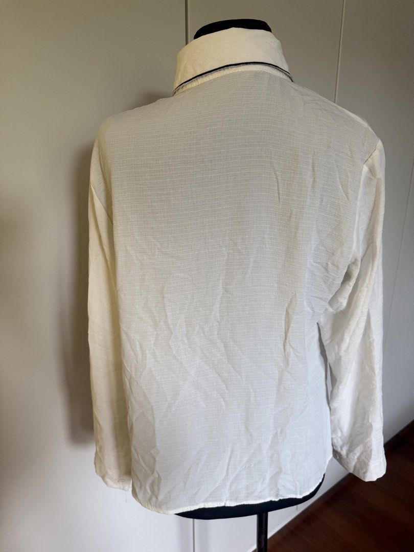 White Long Sleeve Shirt with Cat Collar Detail (Category: Longsleeves) located in Manila. Submitted by cristycrab247 (Listing ID 1463772611, Image 3). Description: - White long sleeve shirt - Unique collar with black embroidered cat design - Button-up front - Lightweight fabric, perfect for layering - Simple and cute style - well loved shirt, please adjust expectations .