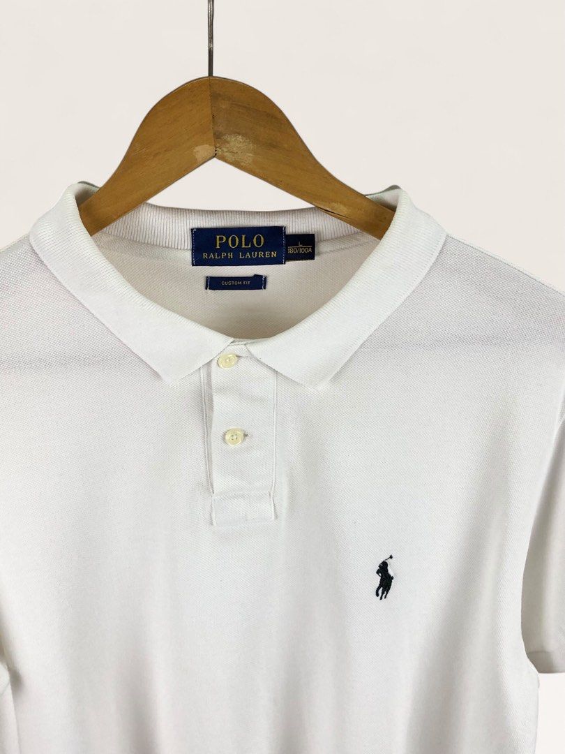 White RL Navy Blue Pony (Category: Tshirts & Polo Shirts ) located in Manila. Submitted by 12essentials (Listing ID 1463891657, Image 2). Description: 📌 Excellent Condition 📌 L on tag 📌 Length 27’ Width 20.5’ - Classic white Polo Ralph Lauren polo shirt - Custom fit style - Iconic embroidered pony logo - Made from 100% cotton - Versatile for casual or smart-casual outfits - Easy to pair with jeans, shorts, or chinos.