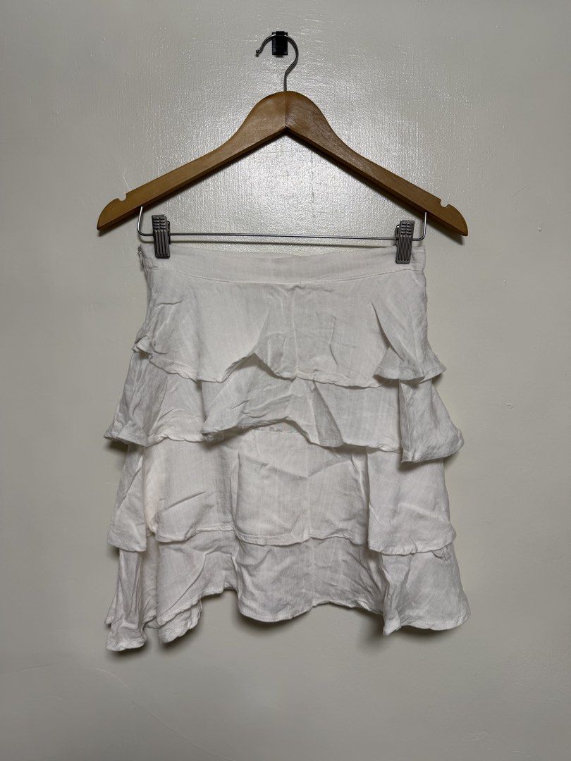 White Ruffle Tiered Mini Skirt (Category: Skirts) located in Manila. Submitted by don_p (Listing ID 1463865932, Image 1). Description: M to L - Adorable white mini skirt with fun tiered ruffles. - Looks and feels like breathable linen material. - Ideal for summer outfits or beach vacation wear. - Effortlessly style with any simple top. - Comfortable elastic waistband for a perfect fit. - Flirty and playful design..