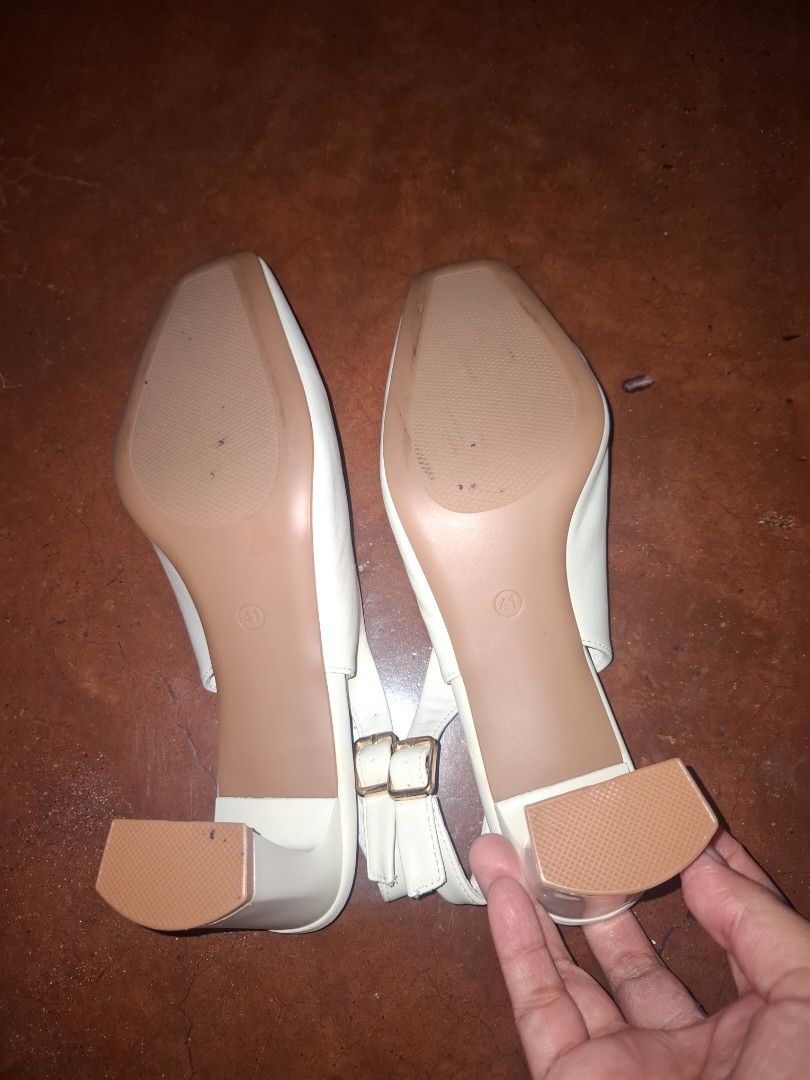 White Slingback Square Toe Heels Size 41 (Category: Heels) located in Caloocan City. Submitted by mariatheresa1994 (Listing ID 1463937366, Image 2). Description: White slingback heels, size 41. Features a square toe, block heel, and ankle buckle strap. Like new, comes with original box. Versatile for any outfit..