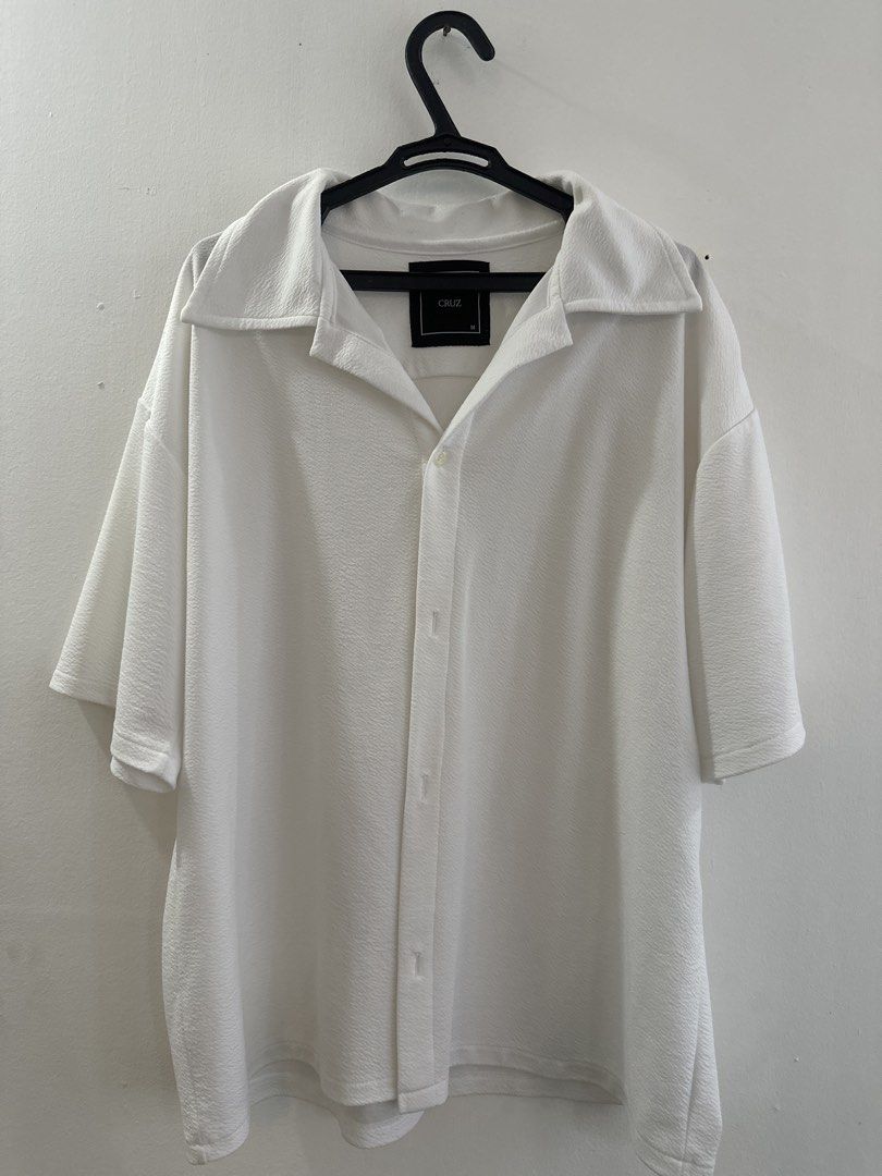 White Textured Short Sleeve Button Up Cuban Shirt (Category: Tshirts & Polo Shirts ) located in Manila. Submitted by rone_cris (Listing ID 1463819813, Image 1). Description: - Brand: CRUZ MNL - Size: Fits M to L - Color: White - Sleeve Length: Short Sleeve - Fabric: Textured - Closure: Button-up front - Collar: Yes - Fit: Relaxed - Style: Casual, Smart-casual.