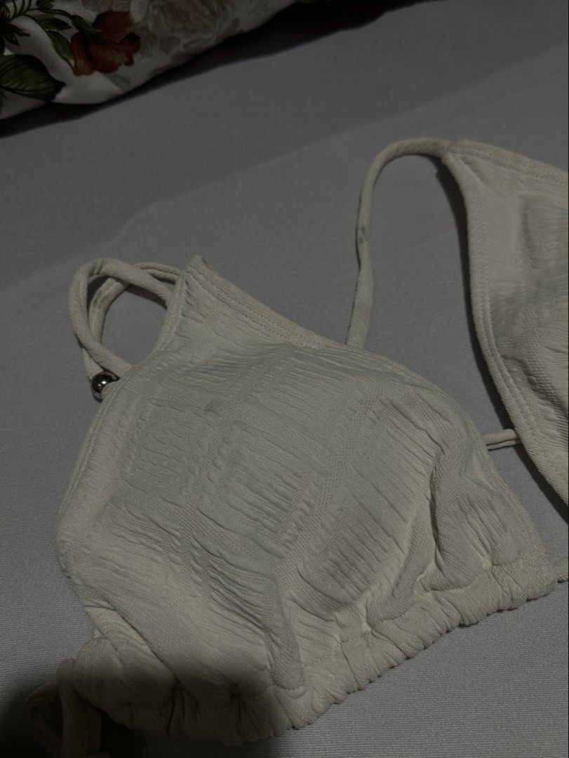 White Textured Triangle Bikini Set (Category: Bikinis & Swimsuits) located in Manila. Submitted by erikaerika05 (Listing ID 1463890521, Image 2). Description: Simple, cute & flattering bikini set White/cream textured fabric 🎀 Adjustable tie straps on the top and bottom Lightly used — worn only once 📏 Best fit for up to 5’2” height (M-L) 🫧 May have minimal washable stains from use/storage 📸 Photo note: Actual color may slightly vary from the p