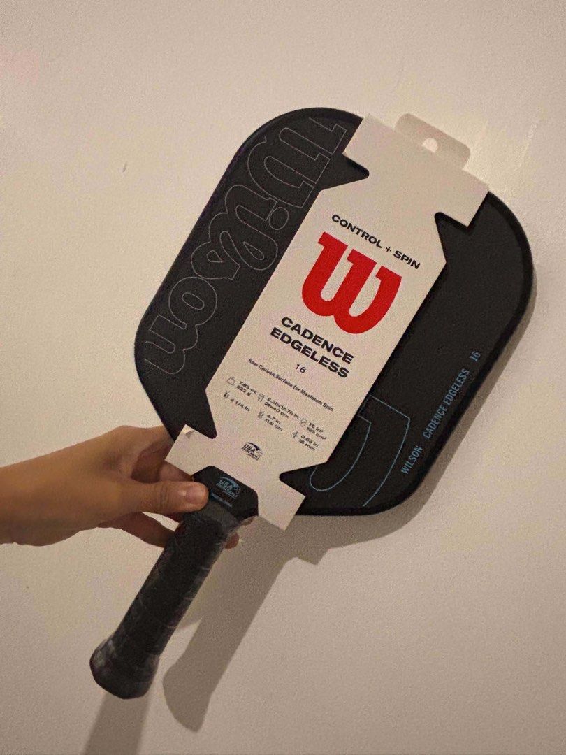 Wilson Cadence Edgeless 16 Pickleball Paddle (Category: Racket and Ball Sports) located in Quezon City. Submitted by raket_garage (Listing ID 1463933331, Image 2). Description: - Authentic, store-bought - Raw carbon surface for maximum spin - Designed for Control + Spin - USA Pickleball approved - Weight: 7.83 oz (222 g) - Dimensions: 8.25x15.75 in (21x40 cm) - Grip size: 4 1/4 in (11.9 cm) - Head size: 76 in² (193 cm²) - Thickness: 0.63 in (16 m