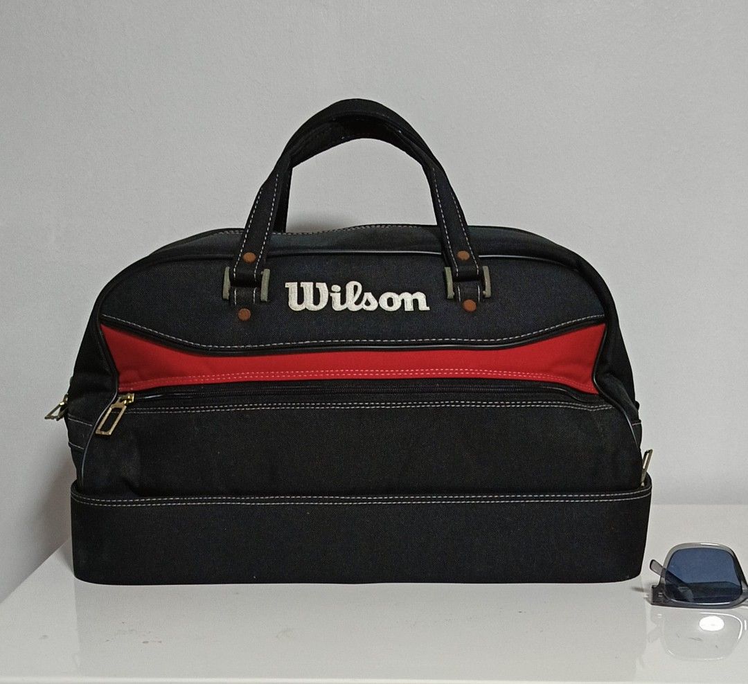 Wilson Duffel Bag Tennis (Category: Backpacks) located in Paranaque City. Submitted by yesyesyo (Listing ID 1463816488, Image 3). Description: - Classic Wilson duffel bag - Color: Black with red accent stripe - Features sturdy handles and a zippered compartment - Ideal for gym sessions or travel - Spacious interior - used with care - lots of compartment this is not thrifted. all are for personal decluttering only. payment thru Gcash delivery opti
