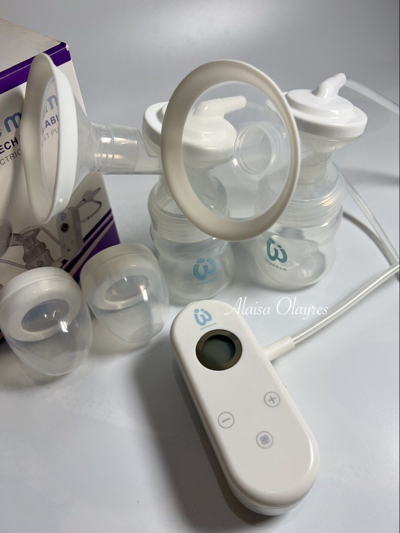 Wisemom Pocket Rechargeable Double Electric Breast Pump (Category: Breastfeeding & Bottle Feeding) located in Marilao. Submitted by laisaolyrs (Listing ID 1463757112, Image 3). Description: - Wisemom double electric breast pump - Pocket-sized and rechargeable - Ideal for pumping on the go - Includes two bottles and flanges - Control unit with display screen and +/- buttons - Original box included.