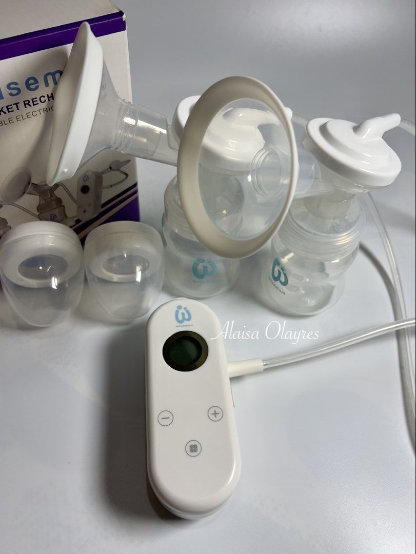 Wisemom Pocket Rechargeable Double Electric Breast Pump (Category: Breastfeeding & Bottle Feeding) located in Marilao. Submitted by laisaolyrs (Listing ID 1463757112, Image 1). Description: - Wisemom double electric breast pump - Pocket-sized and rechargeable - Ideal for pumping on the go - Includes two bottles and flanges - Control unit with display screen and +/- buttons - Original box included.