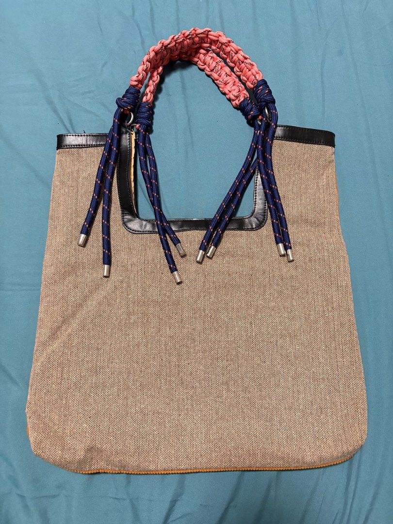 Woven Tote Bag with Rope Handles (Category: Tote Bags) located in Mandaluyong City. Submitted by sarisaringtinda (Listing ID 1463864436, Image 1). Description: - Unique woven tote bag - Braided rope handle in pink and navy blue - Tan herringbone weave body - Bright orange corduroy back - Black trim around top opening - Ideal for everyday use or beach trips.