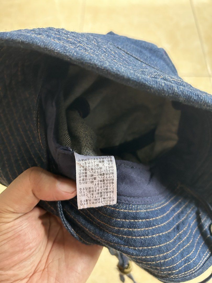 Wrangler Denim Bucket Hat (FREE SHIP) (Category: Hats & Beanies) located in General Santos City (Dadiangas). Submitted by moana_thrifts (Listing ID 1463799054, Image 3). Description: - Classic blue denim bucket hat from Wrangler - Features embroidered Wrangler logo on the front - Adjustable chin strap with toggles for a secure fit - Ideal for sunny outdoor adventures - Simple, stylish, and versatile.