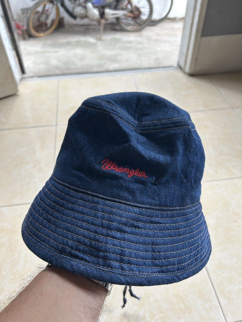 Wrangler Denim Bucket Hat (FREE SHIP) (Category: Hats & Beanies) located in General Santos City (Dadiangas). Submitted by moana_thrifts (Listing ID 1463799054, Image 2). Description: - Classic blue denim bucket hat from Wrangler - Features embroidered Wrangler logo on the front - Adjustable chin strap with toggles for a secure fit - Ideal for sunny outdoor adventures - Simple, stylish, and versatile.