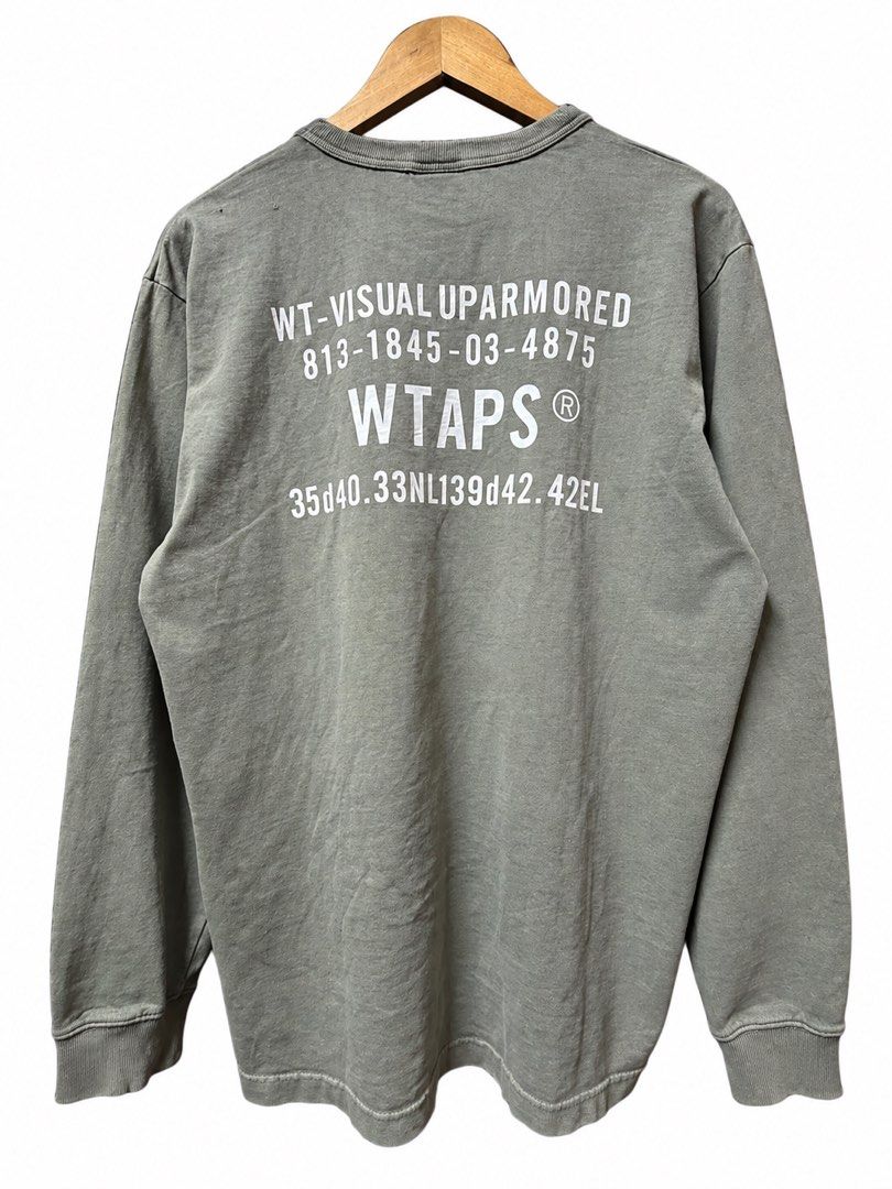 WTAPS Visual Uparmored Crewneck Sweatshirt (Category: Coats, Jackets and Outerwear) located in Tangub. Submitted by laurbepena33002 (Listing ID 1463888769, Image 2). Description: - WTAPS crewneck sweatshirt - Color: Grey - Size: 02 -dimension: W22xL27xSL25 - Features 'WTAPS' and 'WT-VISUAL UPARMORED' print on the back - Tag indicates 'EX35 COLLECTION' - Made in Japan - Ideal for casual outfits.