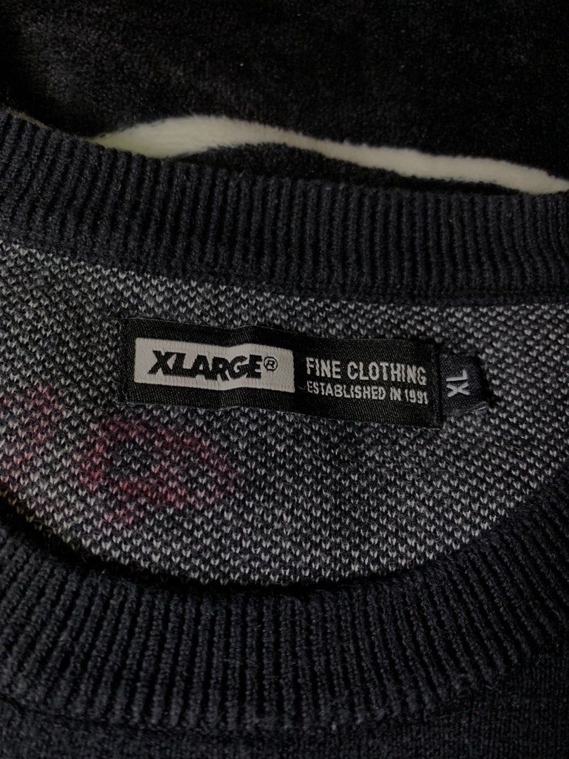 XLARGE Black Knit Sweater (Category: Longsleeves) located in Iloilo. Submitted by johnpullan30303 (Listing ID 1463868705, Image 2). Description: - Brand: XLARGE - Color: Black - Material: Knit sweater - Design: Signature XLARGE logo across the chest in contrasting knit - Features: Ribbed cuffs and hem - Occasion: Casual wear - Sizing: Check tag for details.