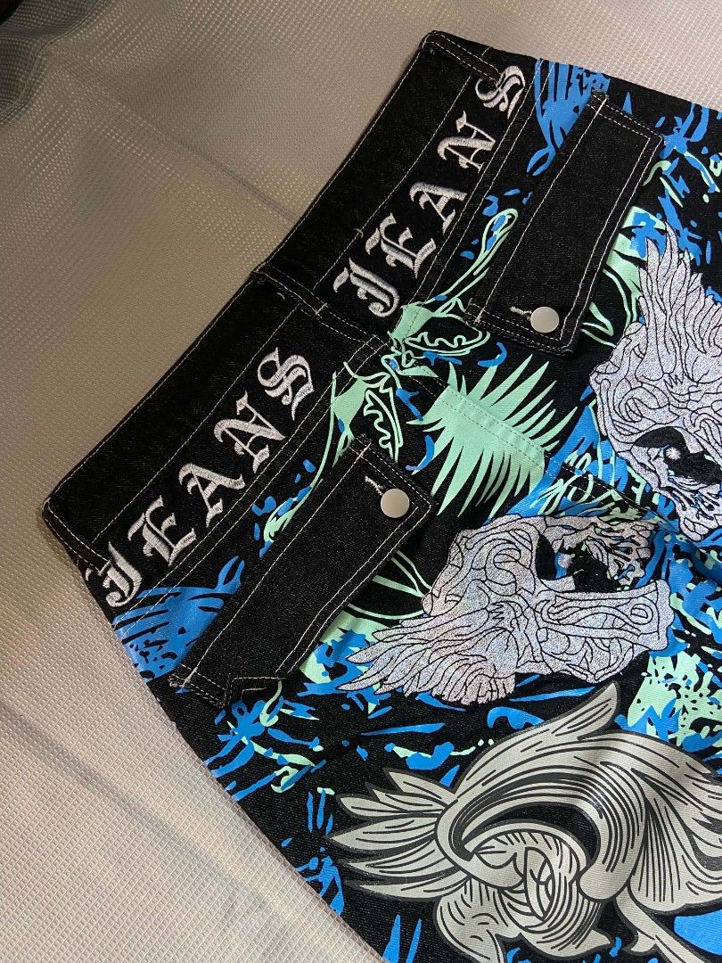 Y2K Graphic Jeans - Blue & Black (Category: Jeans) located in Cebu City. Submitted by jon_roz (Listing ID 1463845526, Image 3). Description: Baggy pants raw denim Hard and semi heavy cotton denim Printed and embroidery design Size 31/32 Length 41 Thigh 13.5 Hem 10 No issues In very good condition 📍 labangon cebu city For pickup or delivery via maxim only Payment first policy if above 150 plus ang delivery fee CAN SHIP NATIONWIDE (payment first p
