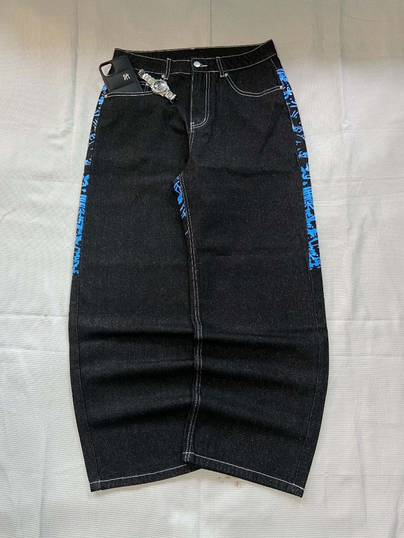 Y2K Graphic Jeans - Blue & Black (Category: Jeans) located in Cebu City. Submitted by jon_roz (Listing ID 1463845526, Image 2). Description: Baggy pants raw denim Hard and semi heavy cotton denim Printed and embroidery design Size 31/32 Length 41 Thigh 13.5 Hem 10 No issues In very good condition 📍 labangon cebu city For pickup or delivery via maxim only Payment first policy if above 150 plus ang delivery fee CAN SHIP NATIONWIDE (payment first p